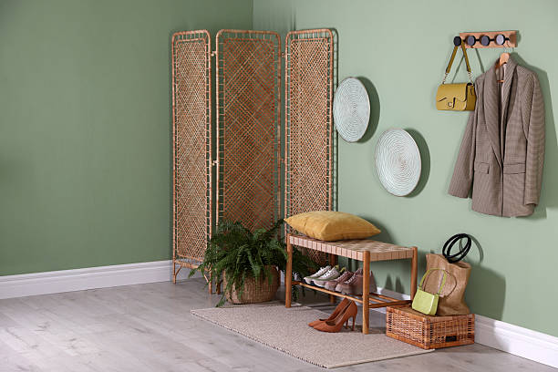 istock Stylish hallway interior with bench and folding screen 2215831415