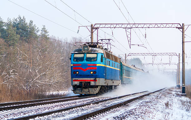 istock Passenger train rapidly moving along the snow track 2215831638