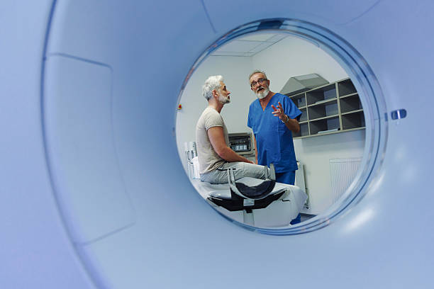 istock Doctor explaining CT scan results to patient in hospital setting 2215835455