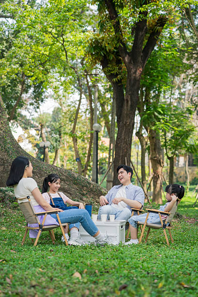 Family Enjoying a Relaxing Picnic in a Quiet and Peaceful Forest Park