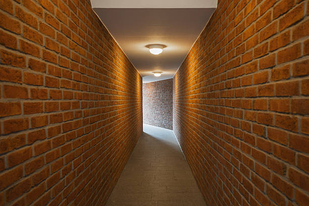brick wall of an empty corridor