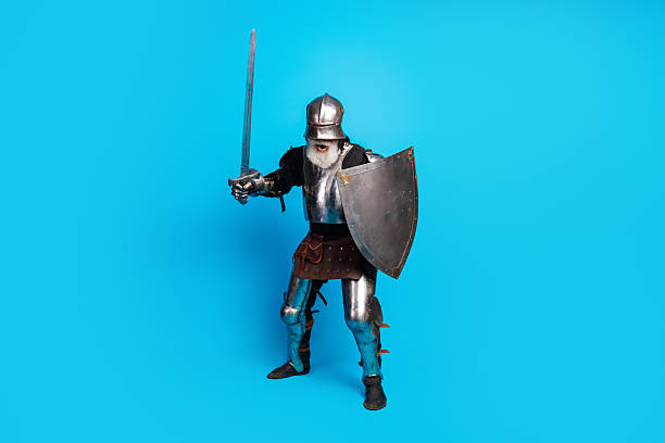 Medieval knight in full armor holding a sword and shield with a blue background representing courage, history, and classic medieval themes