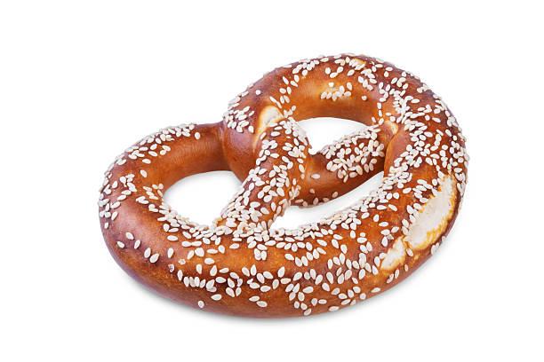 istock Pretzel with sesame seeds on a white isolated background 2215839558