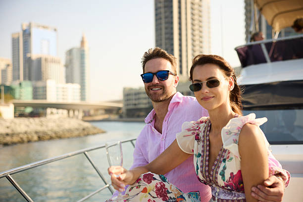 istock Boyfriend and girlfriend sitting on boat deck 2215841417