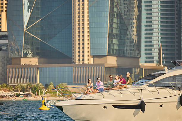istock People sitting on deck of yacht sailing in sea 2215841507