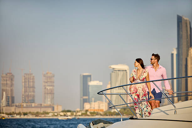 istock Boyfriend and girlfriend standing on boat deck 2215841511