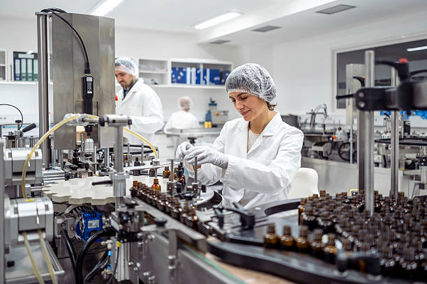 istock Mid Adult Female Lab Worker Packaging Products in a Modern Laboratory Setting 2215843119