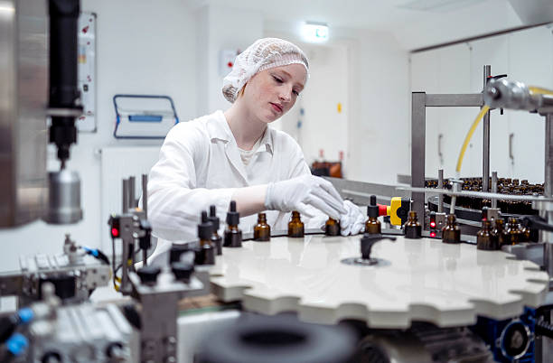 istock Female Lab Worker Ensuring Product Quality in a Modern Packaging Facility 2215843146