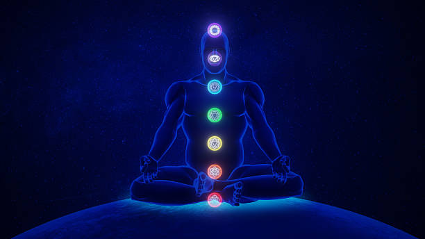 istock Chakra Meditation Silhouette with Glowing Energy Centers 2215843387