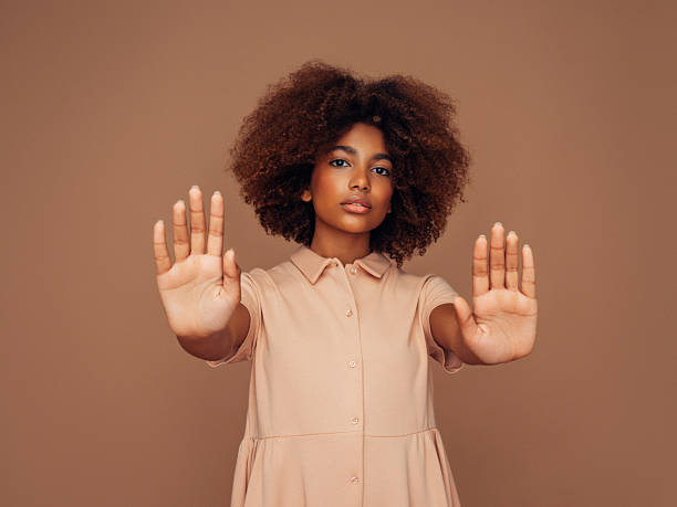 istock Confident woman with outstretched hands in a thoughtful and empowering gesture 2215844113