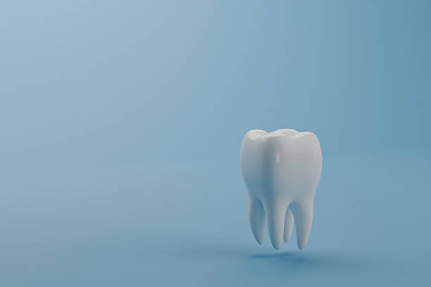 istock tooth on blue background dental health care 3d illustration rendering. 2215844485