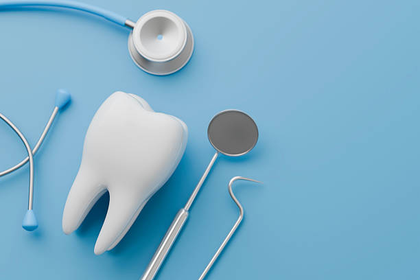 istock Dental health teeth and dentist tools on blue background. 2215844492