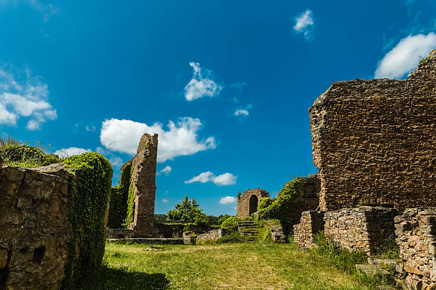 istock Exploring ancient ruins on a sunny day in a lush, green landscape 2215844769