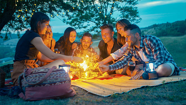 istock Friends lighting sparklers during a summer picnic at dusk 2215845296