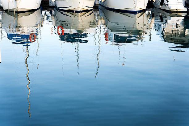 Scenic view of Dunbar Harbour, East Lothian, Scotland. The traditional fishing harbour has a colourful ship and historic building along the seaside. Editorial only.