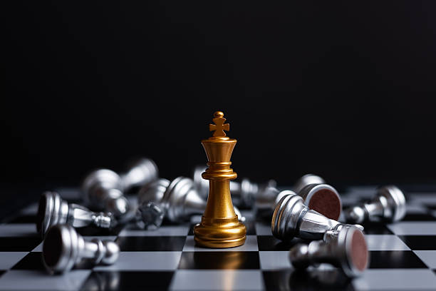 istock king chess piece stand in front of pawn on black background 2215848163