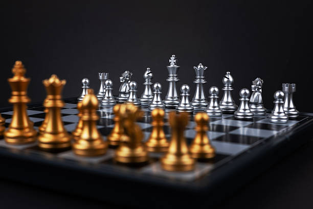istock Golden and silver chess include king queen horse ship and pawn on dark background 2215848351