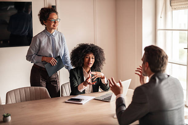 istock Team Engaged in a Productive Business Meeting in a Bright Office Setting 2215848386