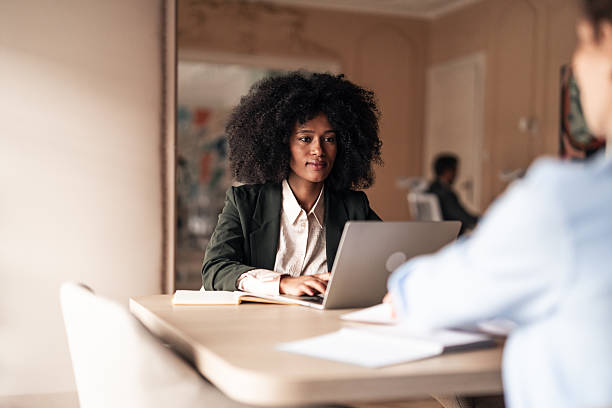 istock Focused Businesswoman Working on Laptop in Modern Office Setting 2215848742