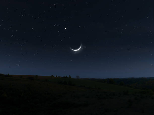 istock New moon and planet Jupiter next to each other in the starry sky. 2215849819