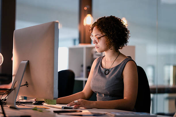 istock Focused Professional Woman Working on a Computer in a Modern Office 2215851465