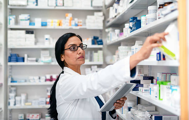 istock Confident Female Pharmacist Working in a Modern Pharmacy While Checking and Organizing Medications 2215852197