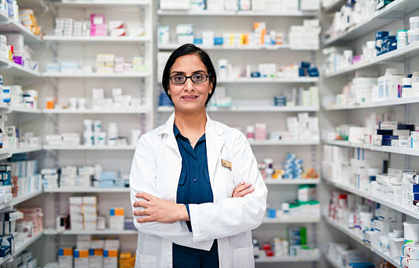 istock Experienced Pharmacist Standing Confidently in a Well-Stocked Pharmacy 2215852198