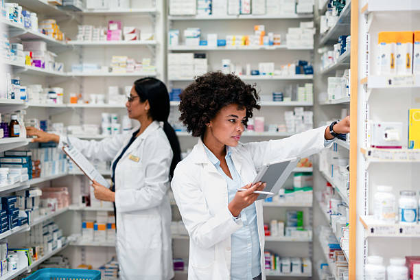 istock Pharmacists Organizing Medication in a Pharmacy Store Setting for Prescription Fulfillment 2215852207