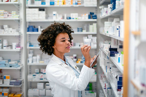 istock Pharmacist Reviewing Medication Stock in a Pharmacy Setting 2215852228