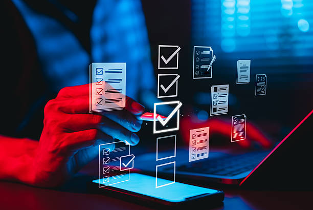 istock Online assessment and survey concept. A person interacts with virtual checklist on laptop, symbolizing online assessments, surveys, exams, or quizzes. digital evaluation and data collection. fill out, 2215852334