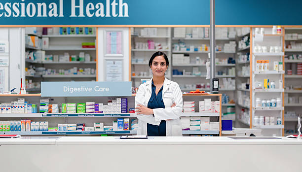 istock Professional Pharmacist Standing at Counter in Modern Pharmacy 2215853123