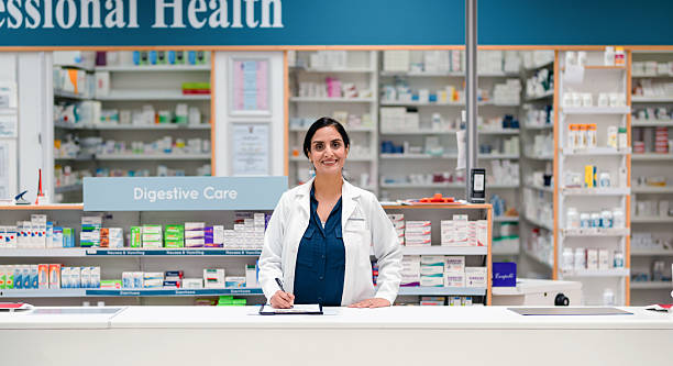 istock Confident Pharmacist Assisting Customers in a Modern Pharmacy Environment 2215853127
