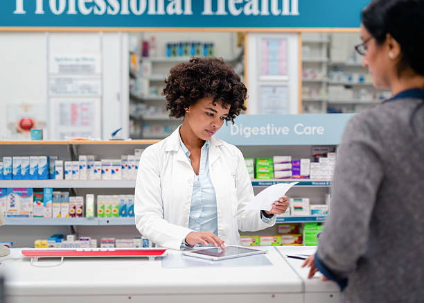 istock Pharmacist Assisting Customer in Pharmacy Retail Setting With Prescription Guidance and Professional Care 2215853171