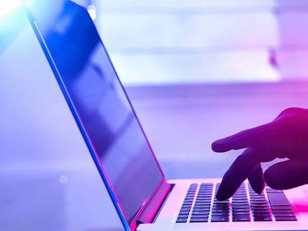 istock A hand typing on a laptop, highlighting technology, work, and online communication 2215855208