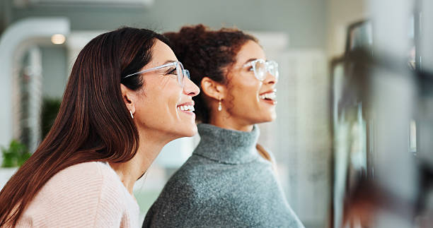 istock Optometry, women and client with glasses, help and friendly service with consultation. Clear vision, customer and professional in store, trust or medical advice for designer frame decision or eyewear 2215855663