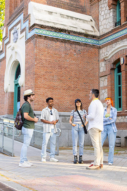 istock Group of young adults engaging in outdoor conversation 2215856441