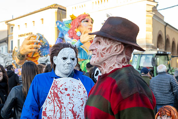 Piove di Sacco, Padua, Italy - Mar 16th, 2025: Carnival parade with people in horror costumes, including Michael Myers and Freddy Krueger