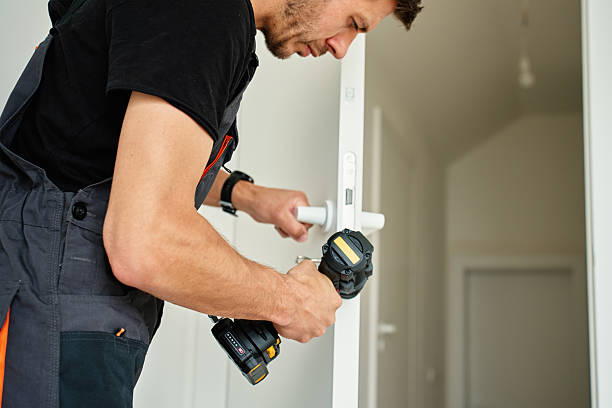 istock Man installs door in apartment during renovation, using cordless screwdriver 2215856859