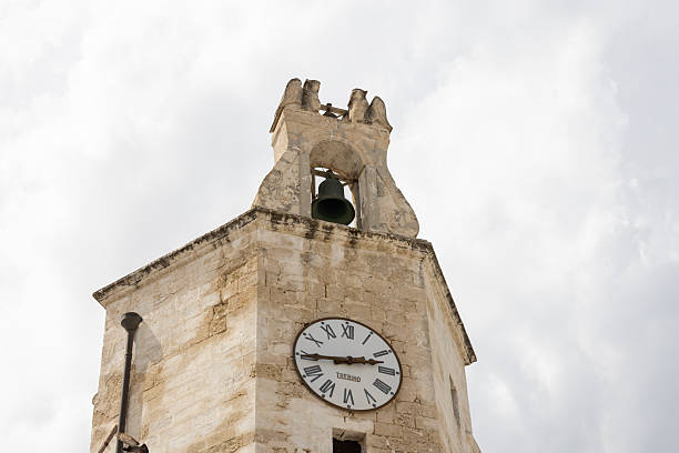 Monopoli, Italy, Apulia - May 21, 2024: Medieval Civic Clock Tower (Torre Civica dell'Orologio), located at Piazza Garibaldi. Tower is one of the symbols of the city