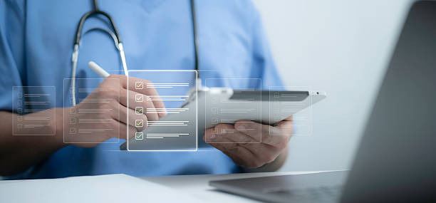 istock Doctor reviews digital checklist on tablet, symbolizing organization, workflow management and precision in modern healthcare smart systems and innovative healthcare technology 2215867921