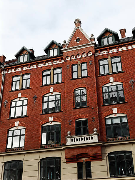 istock Historical brick building facade with decorative windows in urban setting. Copenhagen, Denmark. 2215868104
