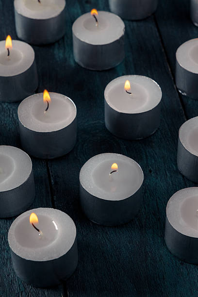 istock Tea light candles on a dark background, many lights in the dark 2215870894