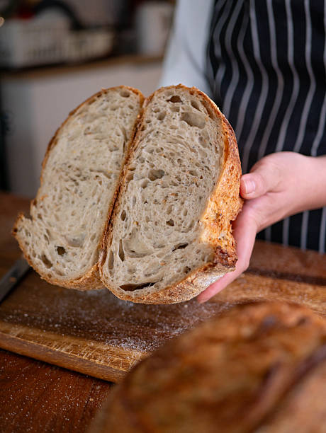 istock Artisan Sourdough Bread in Hand  Fresh from the Oven. 2215872364