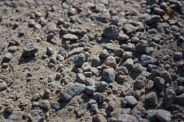 istock Big grey gravel stones among small stones. 2215873526