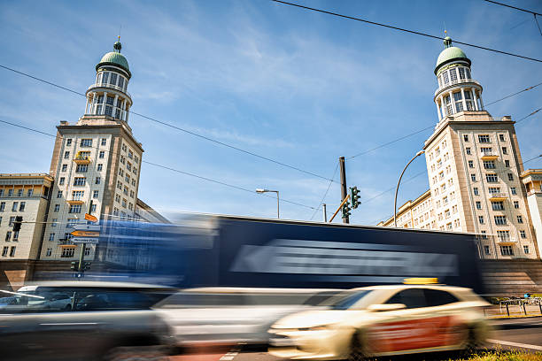 long exposure of car traffic  in front of Frankfurter Tor in Berlin Friedrichshain