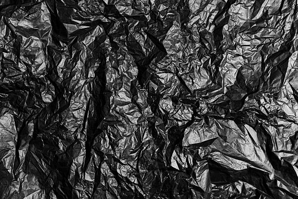 istock Full frame of textured crumpled black paper 2215877332