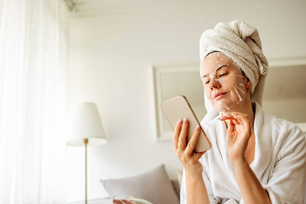 istock Woman Relaxing With a Face Mask in a Cozy Home Setting 2215878515