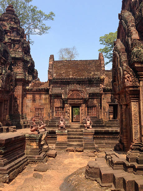 Banteay Srei Temple in Cambodia, known for its intricate red sandstone carvings. Built in the 10th century during the Angkor period, it is dedicated to the Hindu god Shiva and features detailed reliefs and architectural decorations.