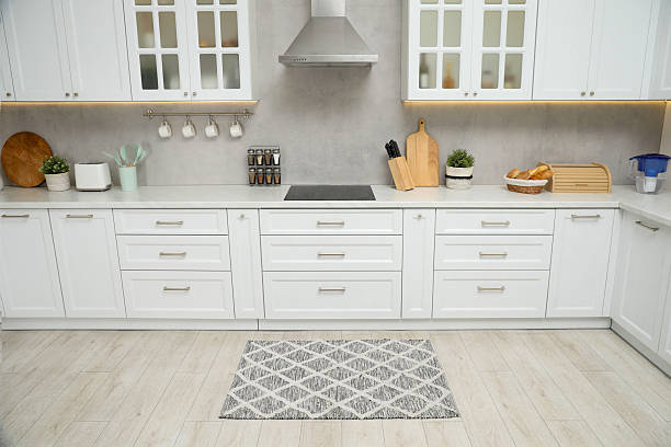 istock Beautiful rug on wooden floor in kitchen 2215886487