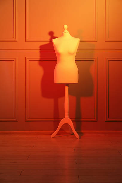 One mannequin near wall in neon lights